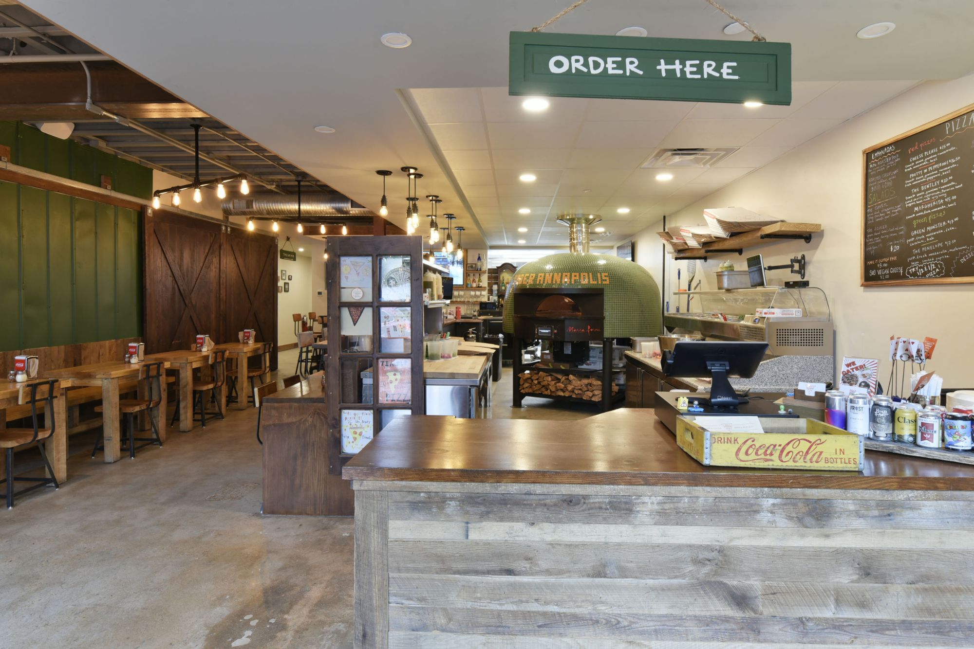 Timber Pizza counter with reclaimed wood and a green wood-fired oven